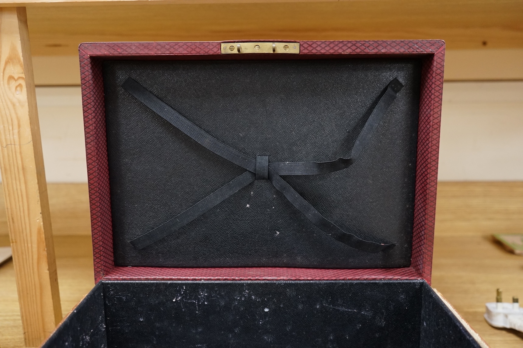 A cased travelling lock box with Bramah lock and leather case, no key, 36cm high
